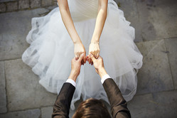  young asian newlywed couple wearing wedding dress dancing in open ground, high angle view. 