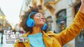 gizmodo_midjourney_a_woman_wearing_blue_headphones_outside_in_d_1eb7faa0-954d-40f8-be5f-92e4418748a2
