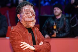 Photo by Harald Krichel https://commons.wikimedia.org/wiki/File:Adam_Pearson-64474.jpg Remixed by THE RIVER